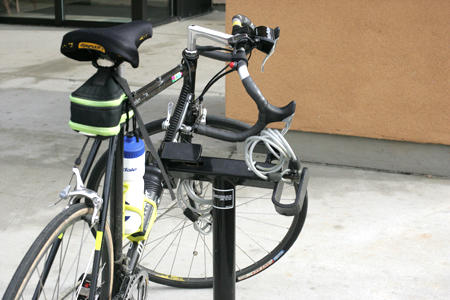 A black, durable steel, spiral-design bike rack